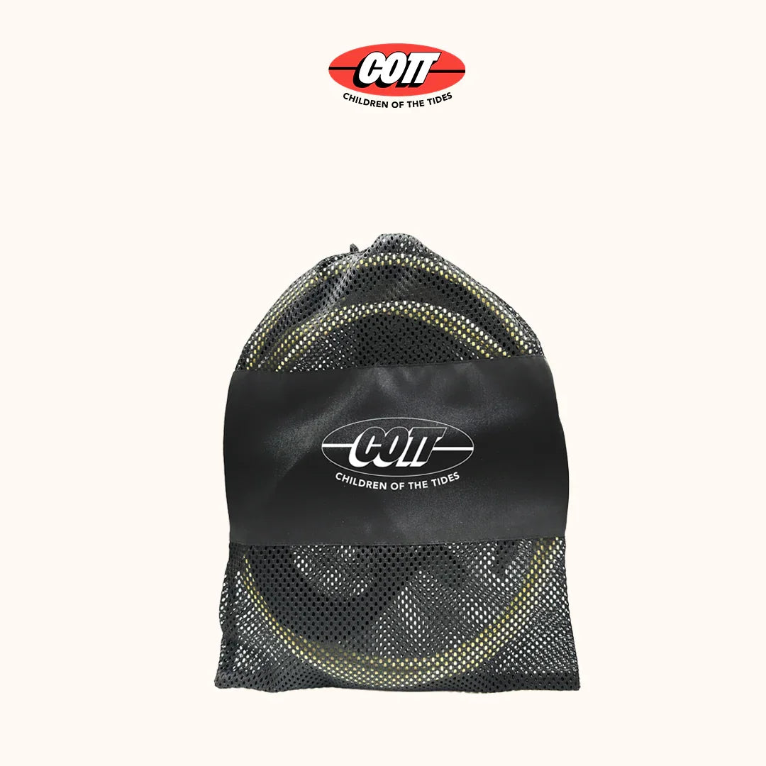 COTT surf leash in black mesh bag with logo, ideal for surfers and beach adventures